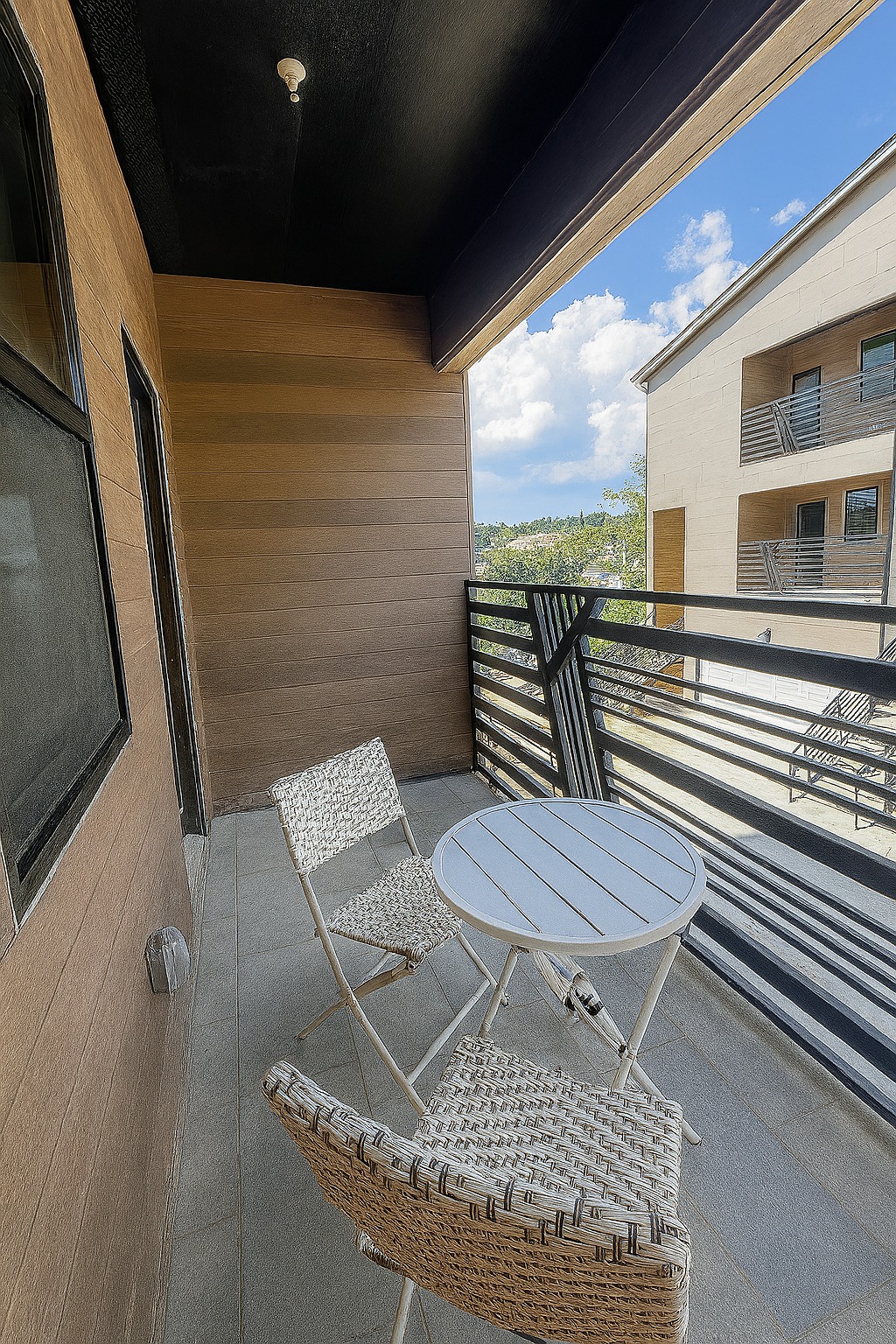Upper-floor balcony with steel railing