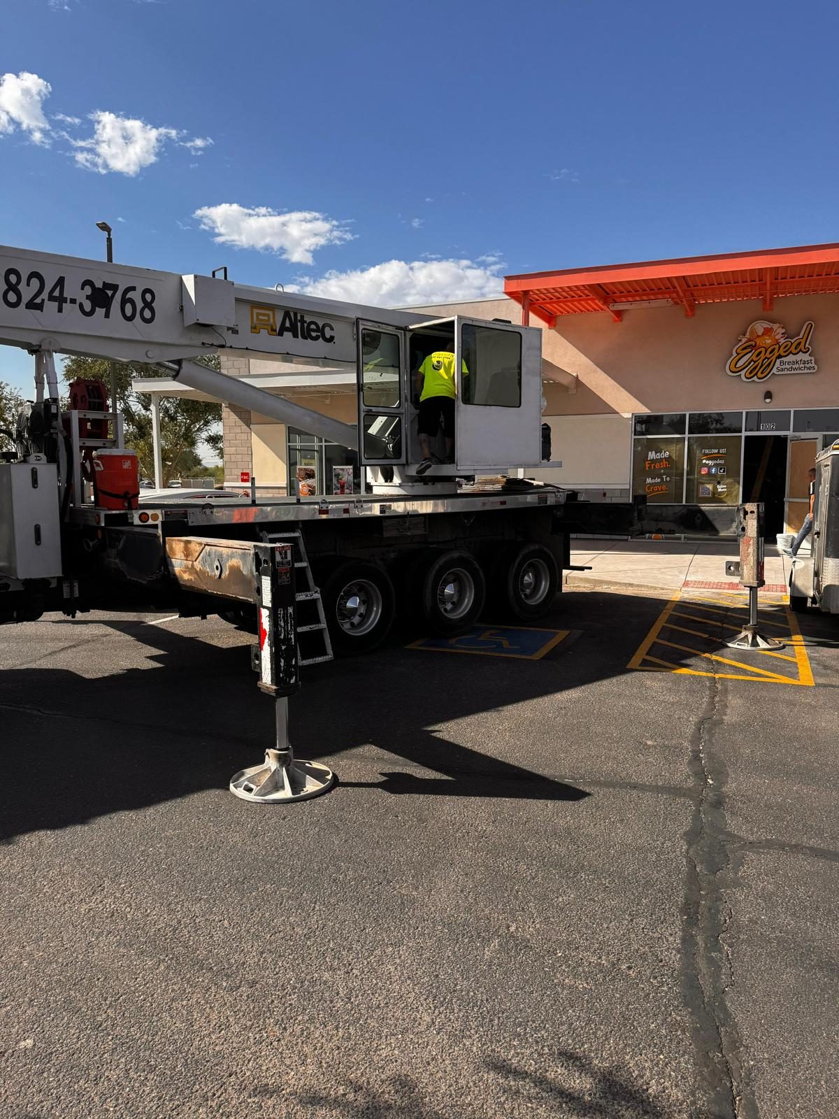 Crane truck set up outside the Egged storefront